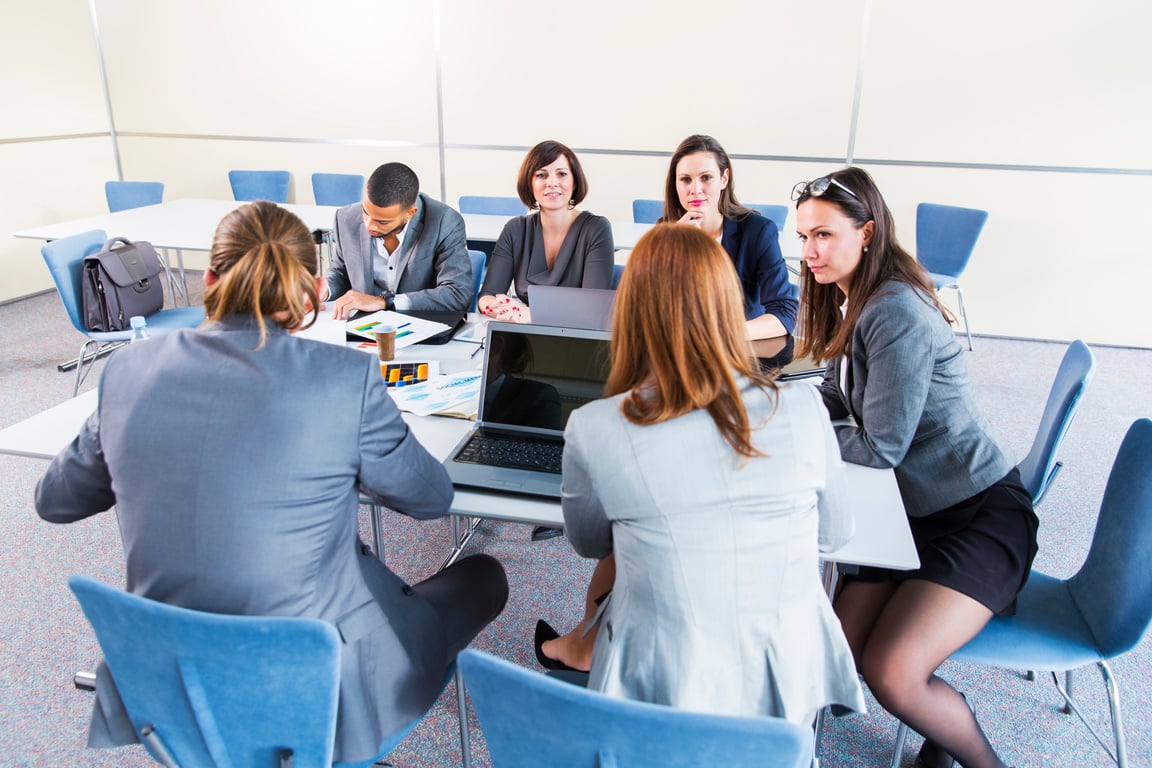 Business people in office talking about their problems,using laptop...